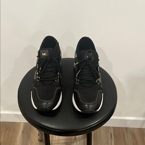 Michael Kors Black and Gold women Sneakers US 6.5 USED , good condition